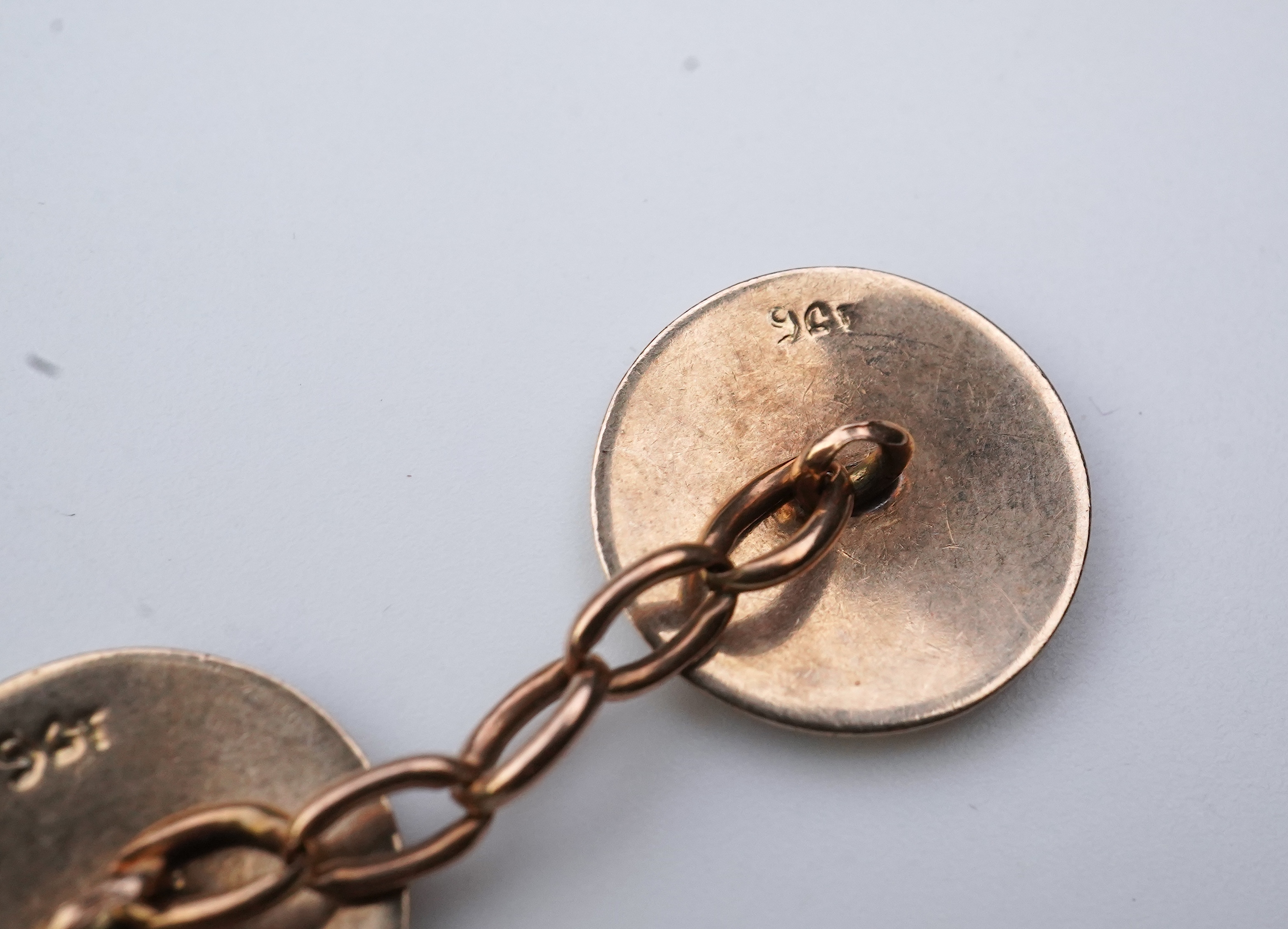 A pair of gold and enamel cufflinks